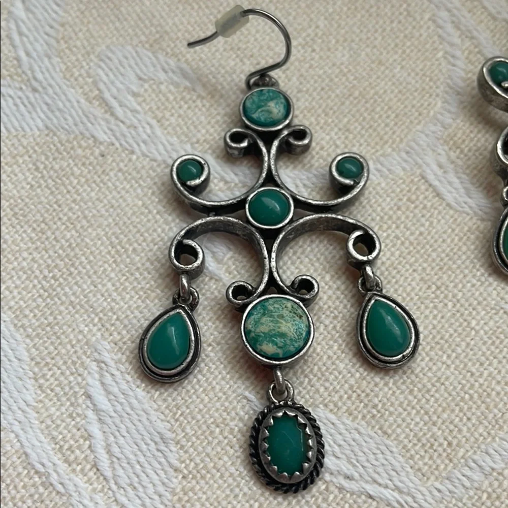 Silver and Green Dangle Earrings with Intricate Design